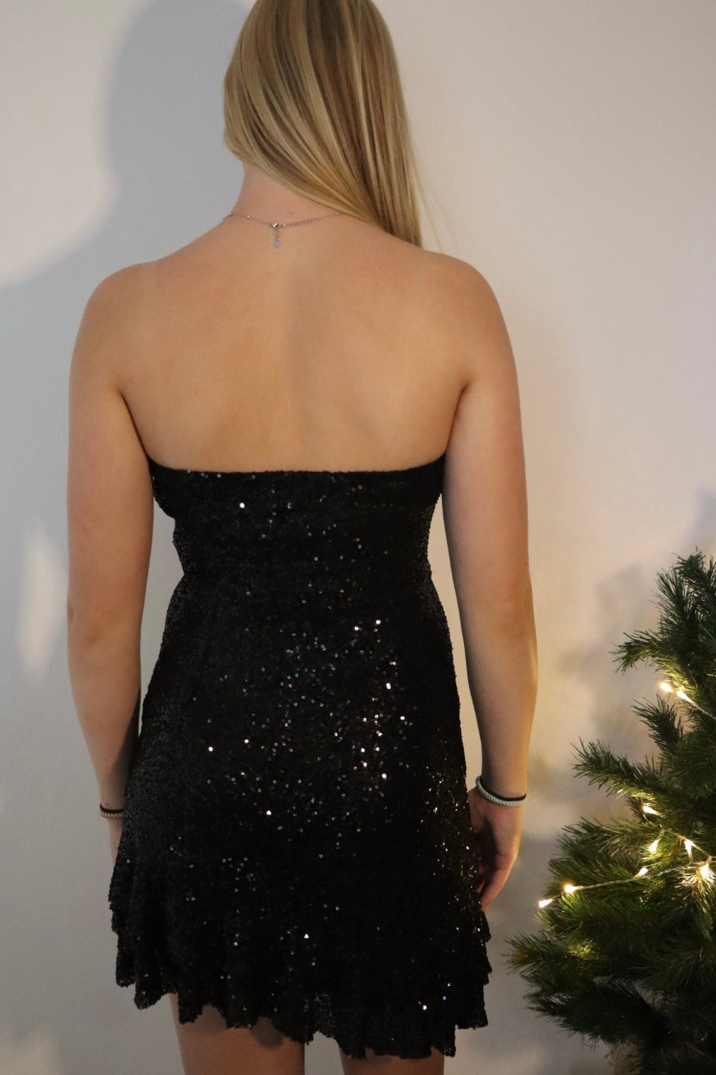 Strapless mini-jurk met pailletten en strikdetail