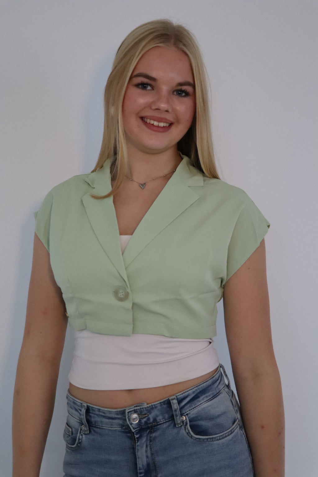 Mouwloze blazer top met enkele knoopsluiting Groen