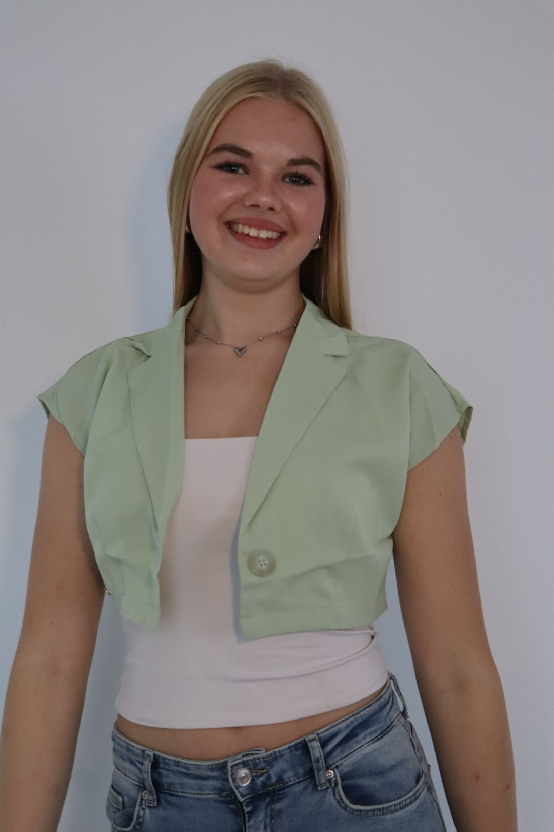 Mouwloze blazer top met enkele knoopsluiting Groen